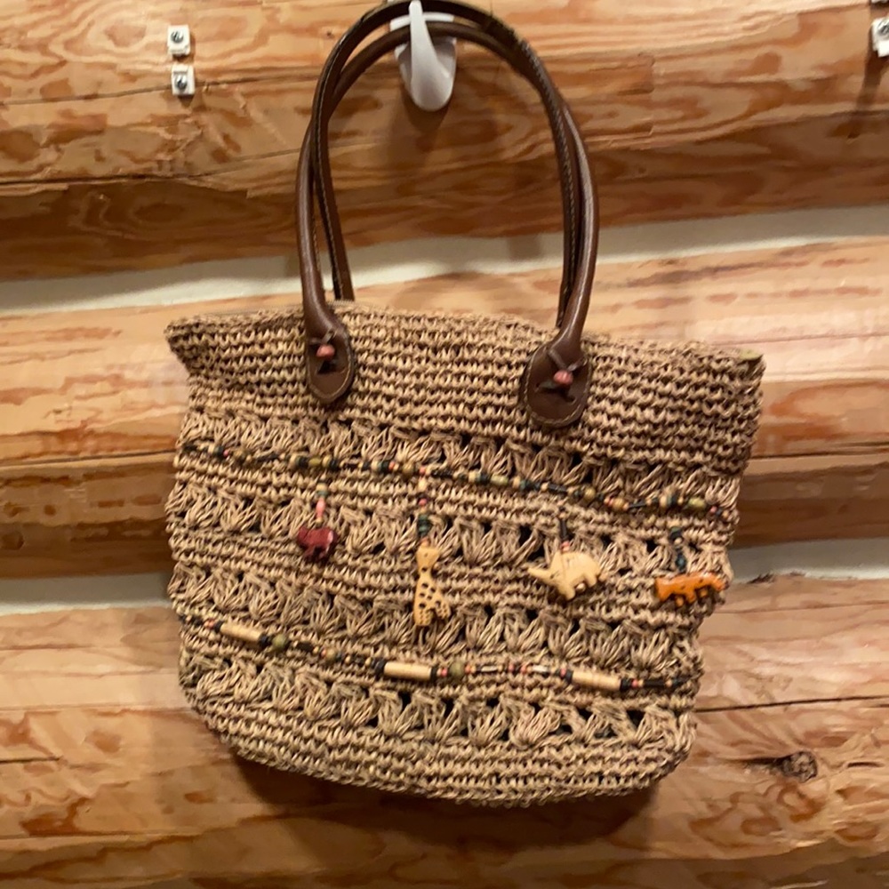 Straw purse with wooden animals